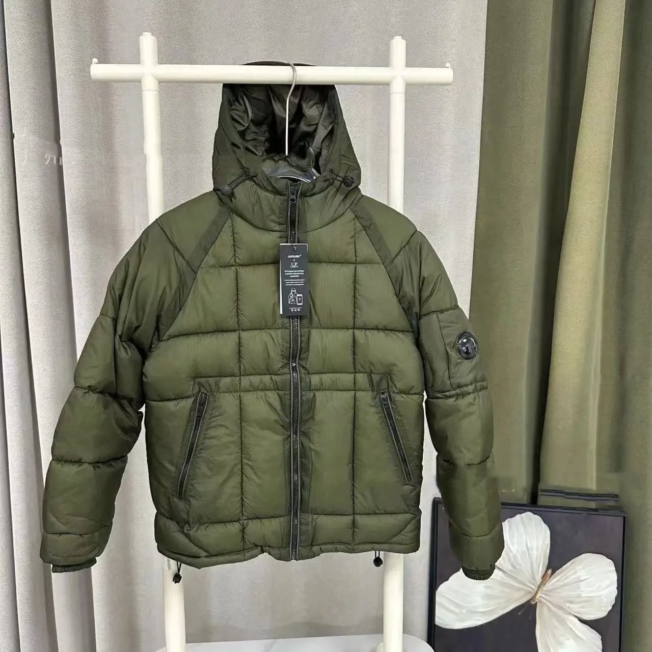 A down jacket - olive green